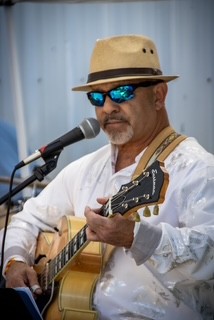 photo of Leonard Solano playing guitar